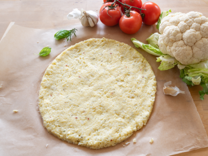 Try this Cauliflower Pizza Crust with Carrot Top Yogurt Pesto recipe today!