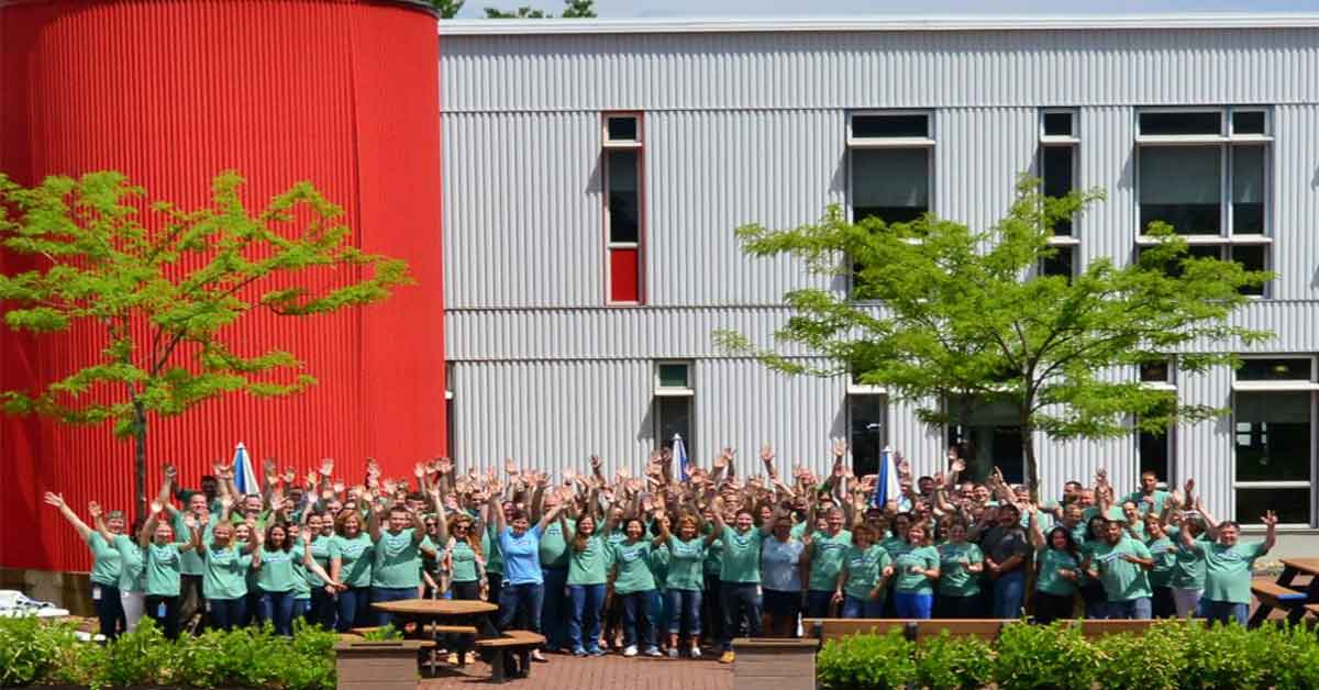Stonyfield Team Cheering In Front Of Plant