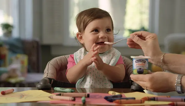 Baby Eating Yogurt Off a Spoon